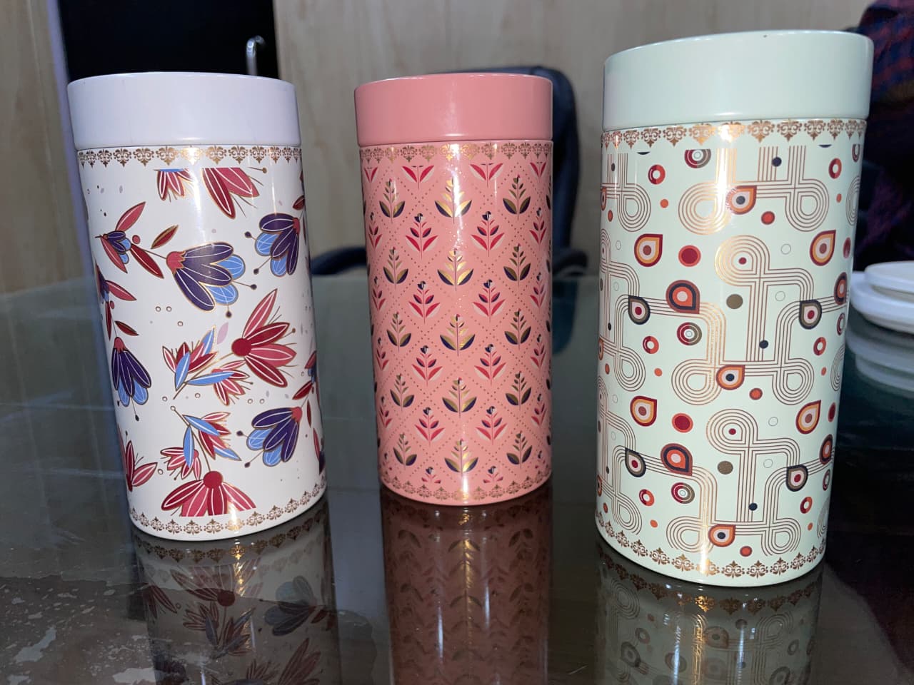 Tall printed tin canisters